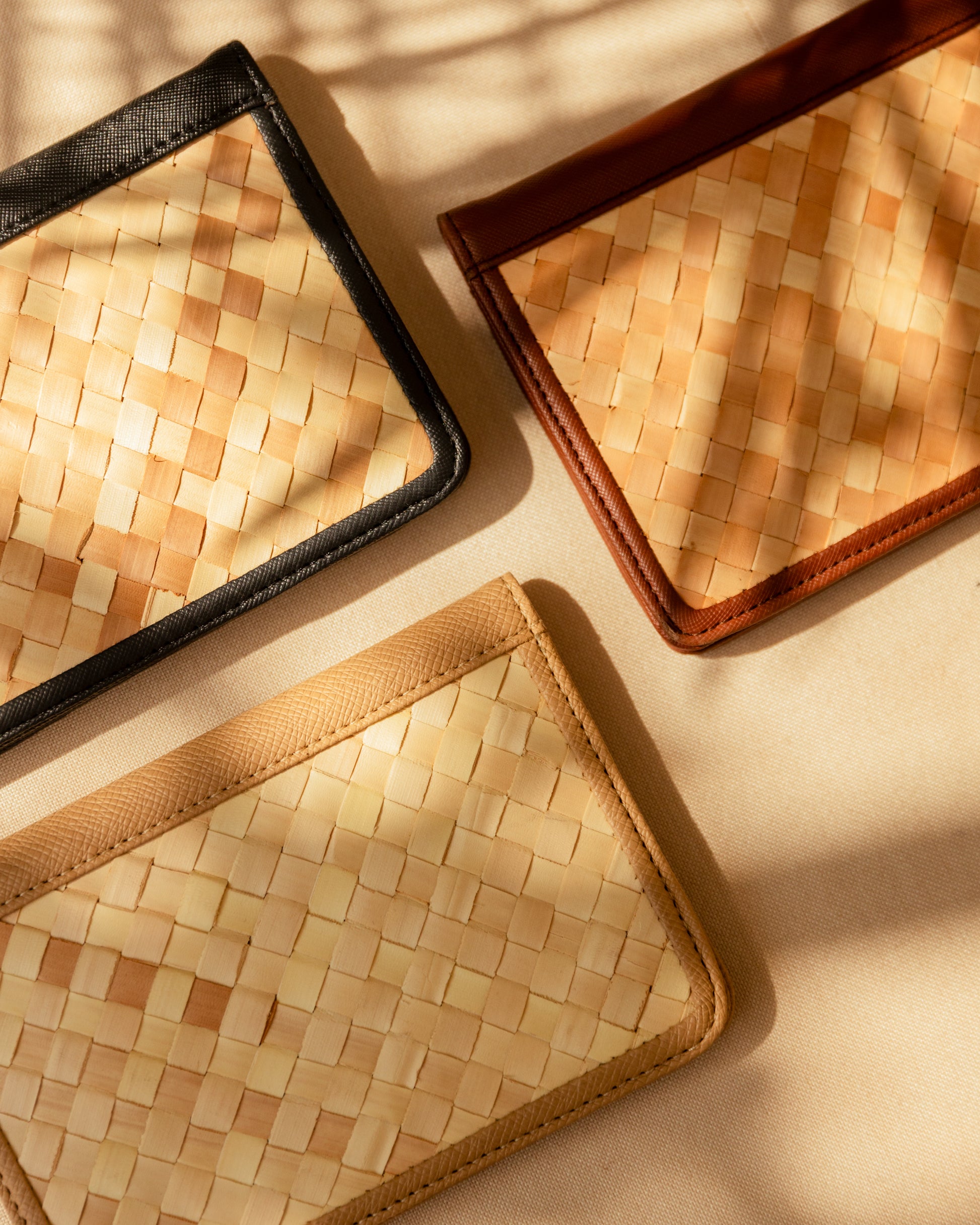 Cove Rattan & Leather Passport Cover handmade by Village Thrive using natural materials.