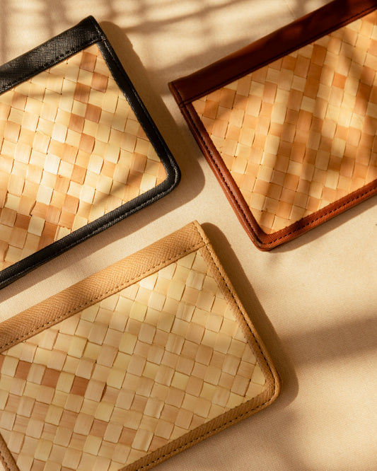 Cove Rattan & Leather Passport Cover handmade by Village Thrive using natural materials.