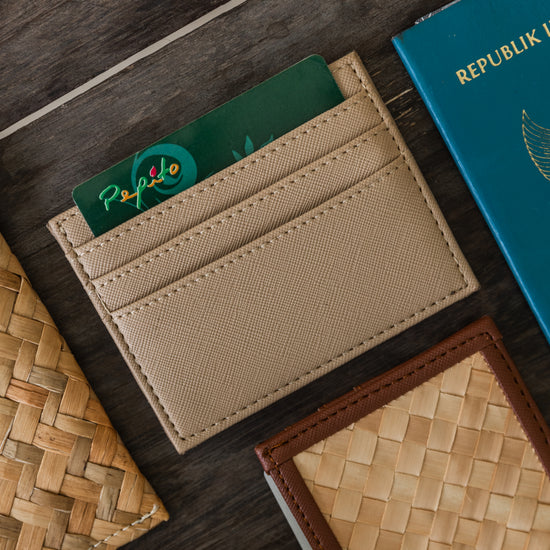Cove Rattan & Leather Card Sleeve Wallet handmade by Village Thrive using natural materials.