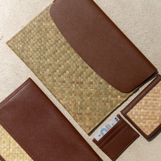 Cove Rattan & Leather Document Sleeve handmade by Village Thrive using natural materials.