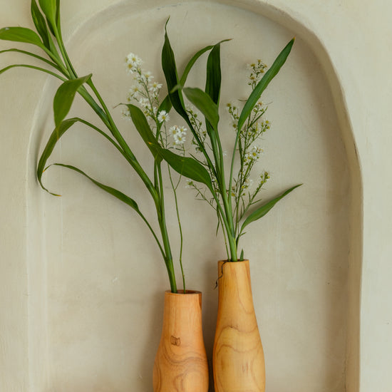 Teak Wavy Vases handmade by Village Thrive using natural materials.