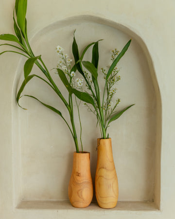 Teak Wavy Vases handmade by Village Thrive using natural materials.