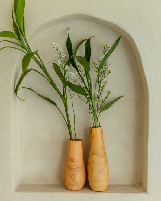 Teak Wavy Vases handmade by Village Thrive using natural materials.