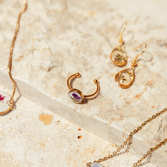 Wildflower Gold Ring handmade by Village Thrive using natural materials.