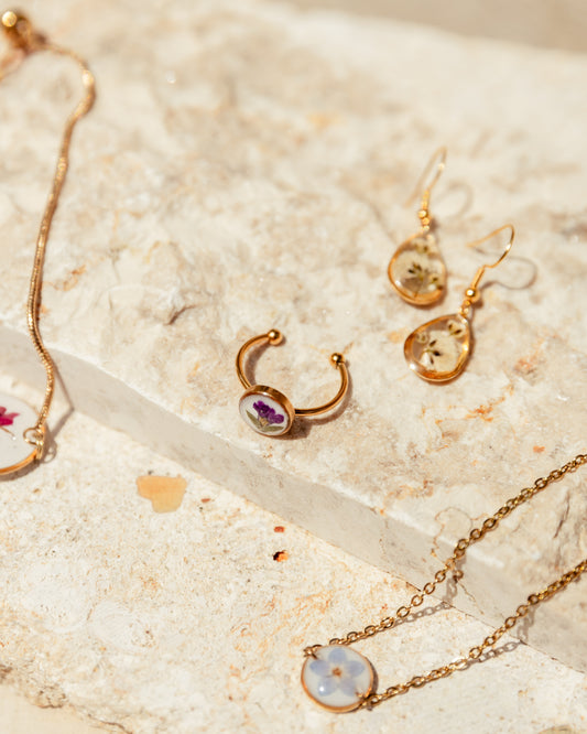 Wildflower Gold Ring handmade by Village Thrive using natural materials.