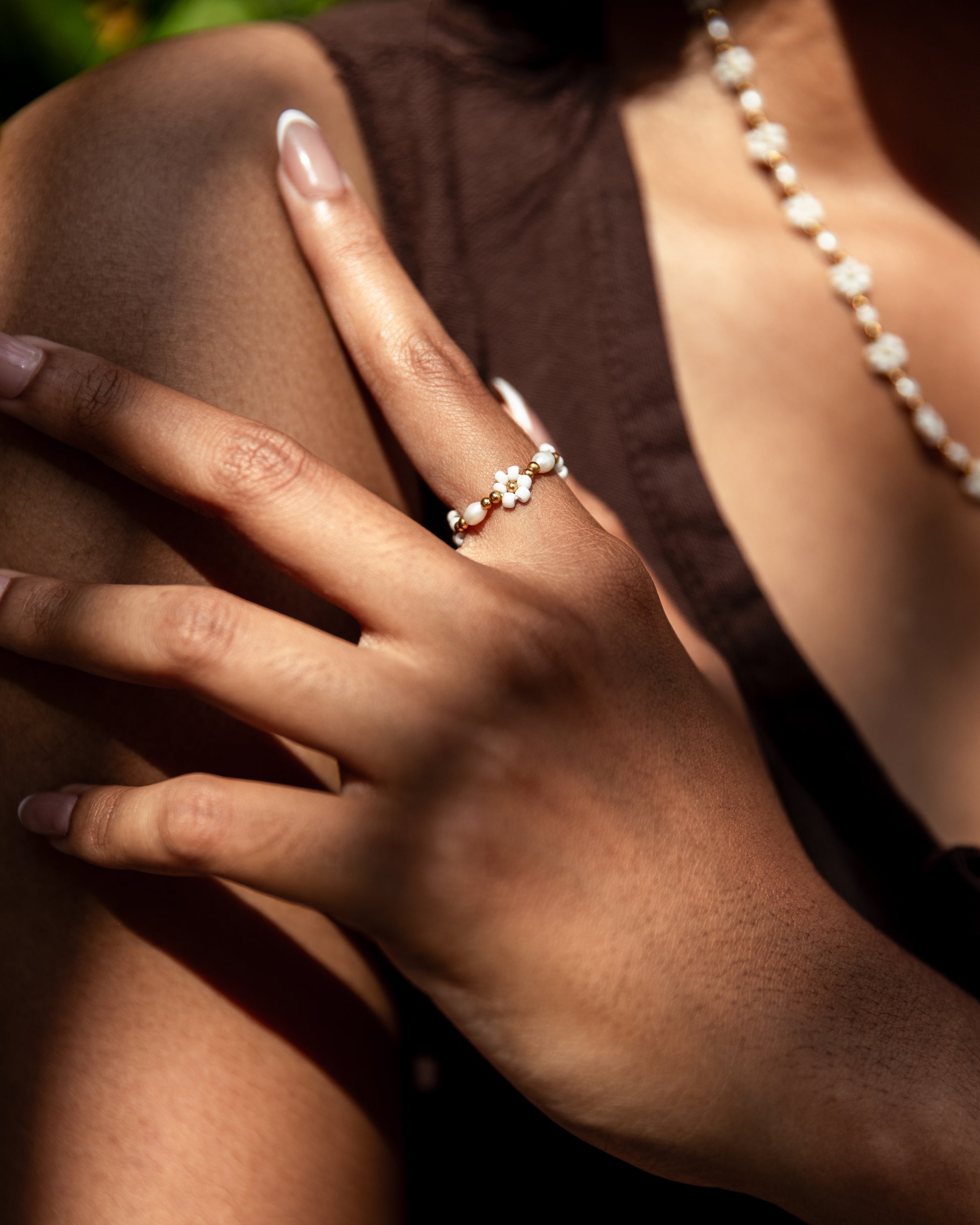 Freshwater Pearl and Flower Beaded Ring handmade by Village Thrive using natural materials.
