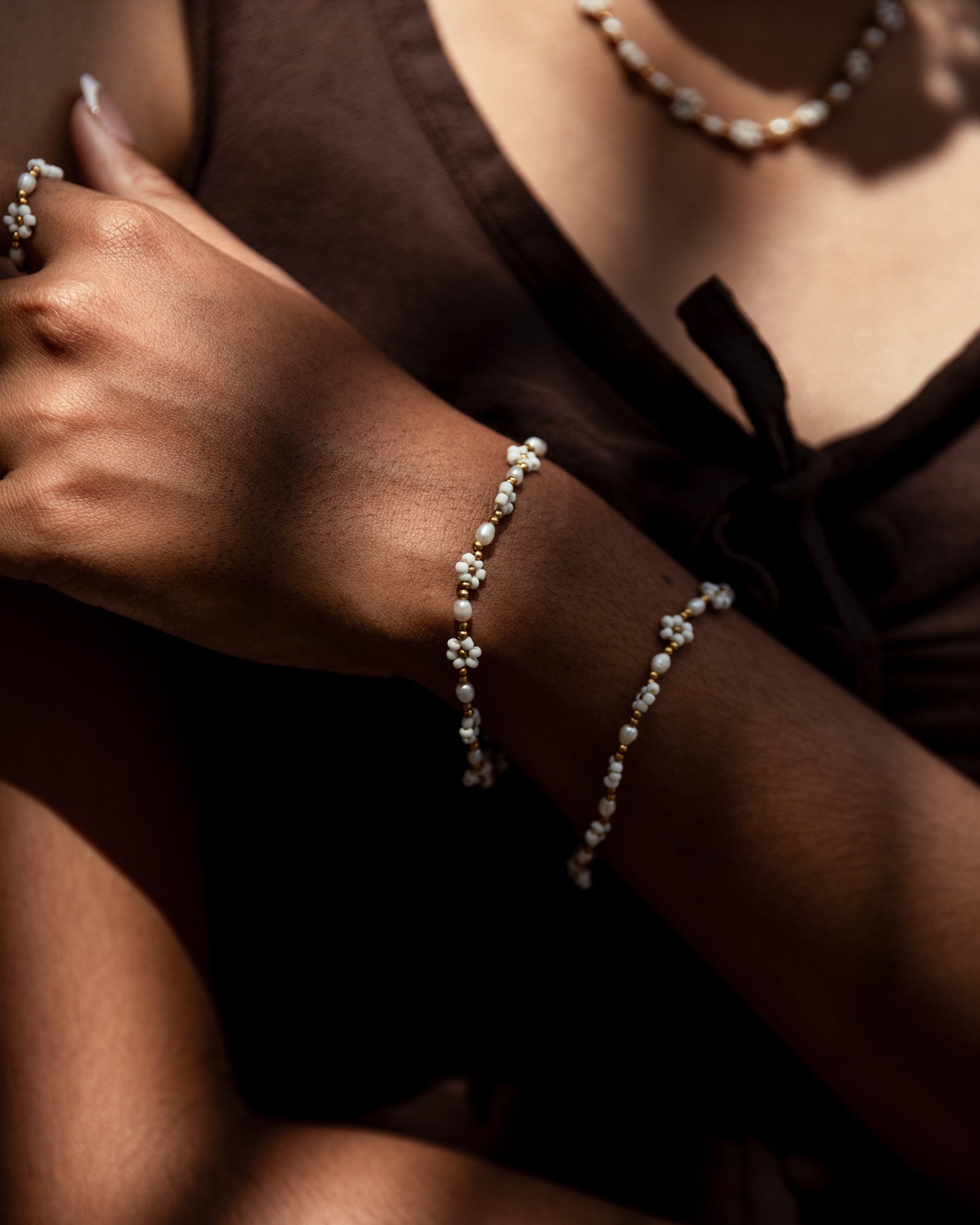 Freshwater Pearl and Flower Beaded Bracelet handmade by Village Thrive using natural materials.