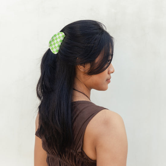 Checkered Hair Clip handmade by Village Thrive using natural materials.