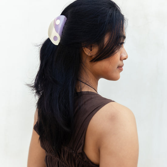 Yin Yang Hair Clips handmade by Village Thrive using natural materials.