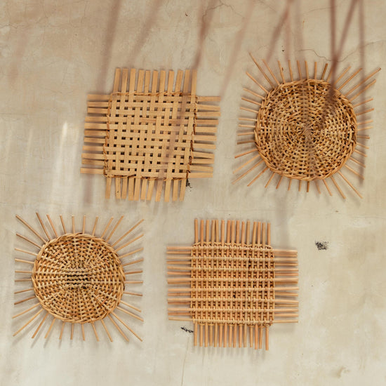 Woven Rattan Wall Decor handmade by Village Thrive using natural materials.