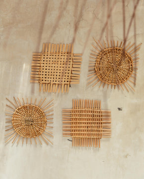 Woven Rattan Wall Decor handmade by Village Thrive using natural materials.
