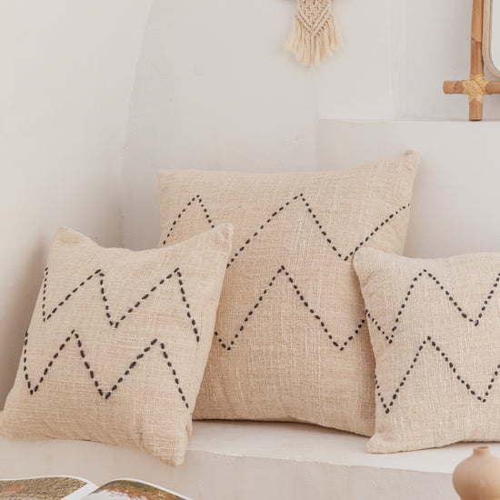 Nya Hand Stitched Cotton Throw Pillow handmade by Village Thrive using natural materials.