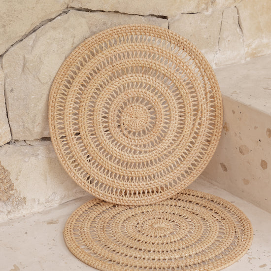 Woven Rattan Placemat Set handmade by Village Thrive using natural materials.