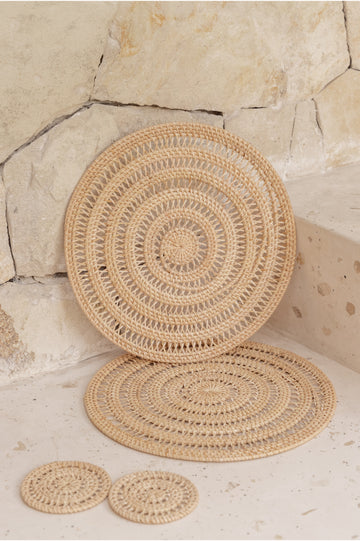 Woven Rattan Placemat Set handmade by Village Thrive using natural materials.