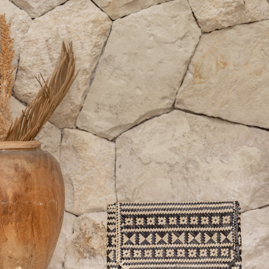 Traditional Motif Rattan Clutch handmade by Village Thrive using natural materials.