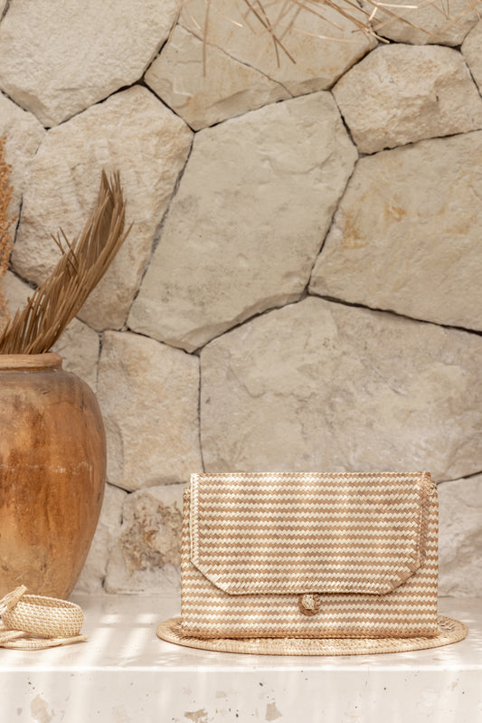 Stripes Rattan Clutch handmade by Village Thrive using natural materials.