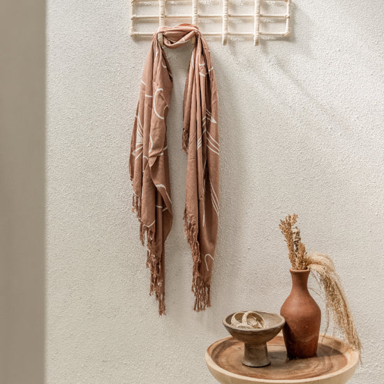 Nusa Rattan Wall Hooks handmade by Village Thrive using natural materials.