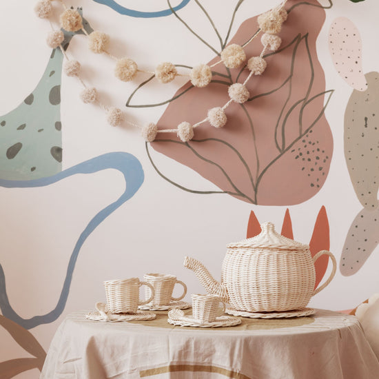 Pom Pom Raffia Garland handmade by Village Thrive using natural materials.