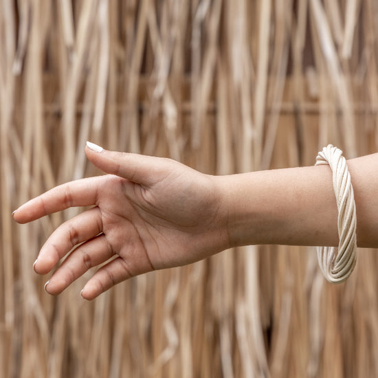 Statement Twist Bangle handmade by Village Thrive using natural materials.