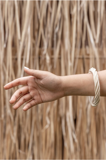 Statement Twist Bangle handmade by Village Thrive using natural materials.