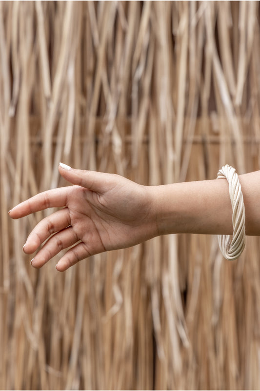 Statement Twist Bangle handmade by Village Thrive using natural materials.