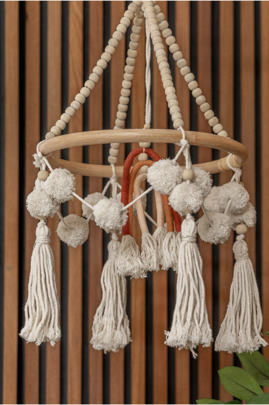 Rainbow Baby Mobile handmade by Village Thrive using natural materials.