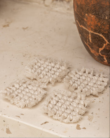 Knotted Macrame Coaster Set handmade by Village Thrive using natural materials.
