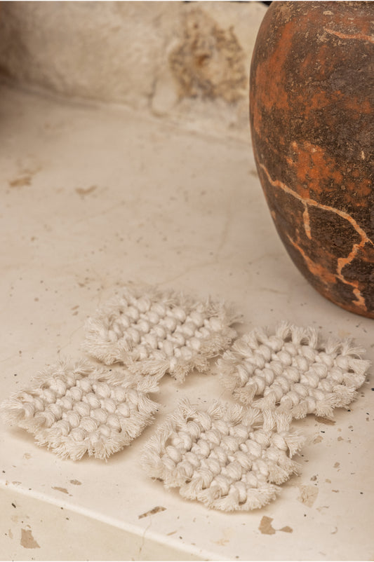 Knotted Macrame Coaster Set handmade by Village Thrive using natural materials.