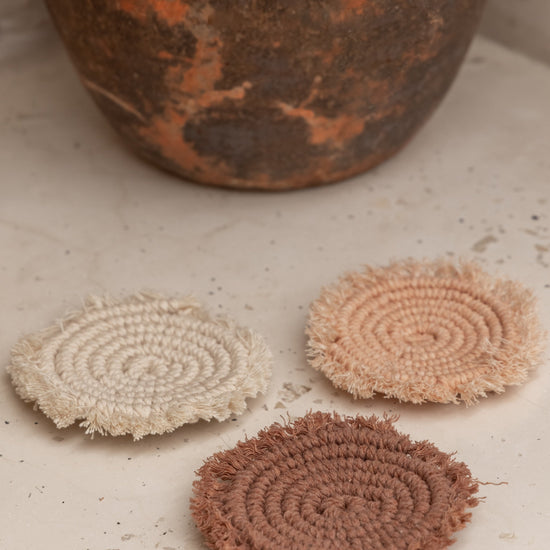 Kera Sunrise Macrame Coaster Set handmade by Village Thrive using natural materials.