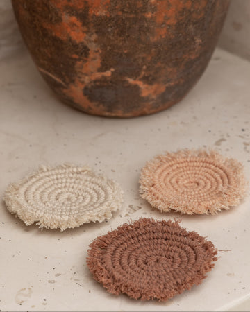 Kera Sunrise Macrame Coaster Set handmade by Village Thrive using natural materials.