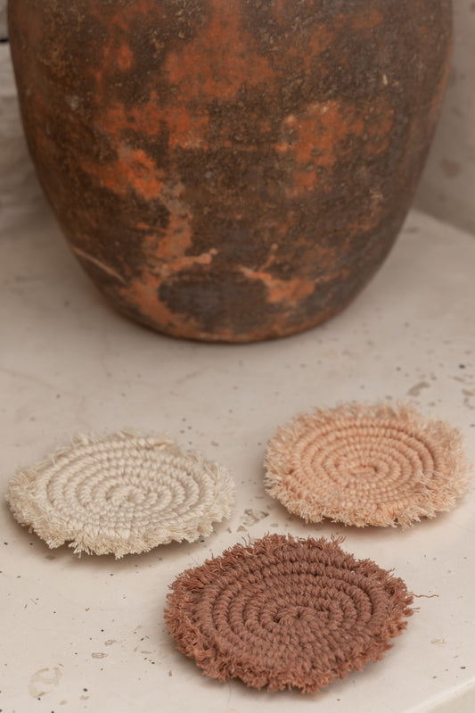 Kera Sunrise Macrame Coaster Set handmade by Village Thrive using natural materials.
