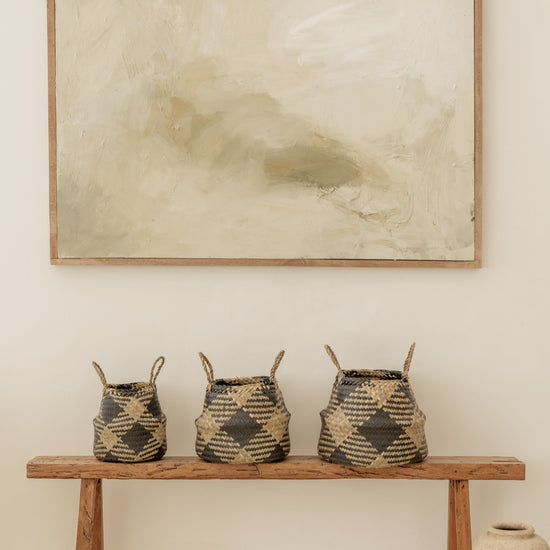 Plaid Woven Storage Basket handmade by Village Thrive using natural materials.