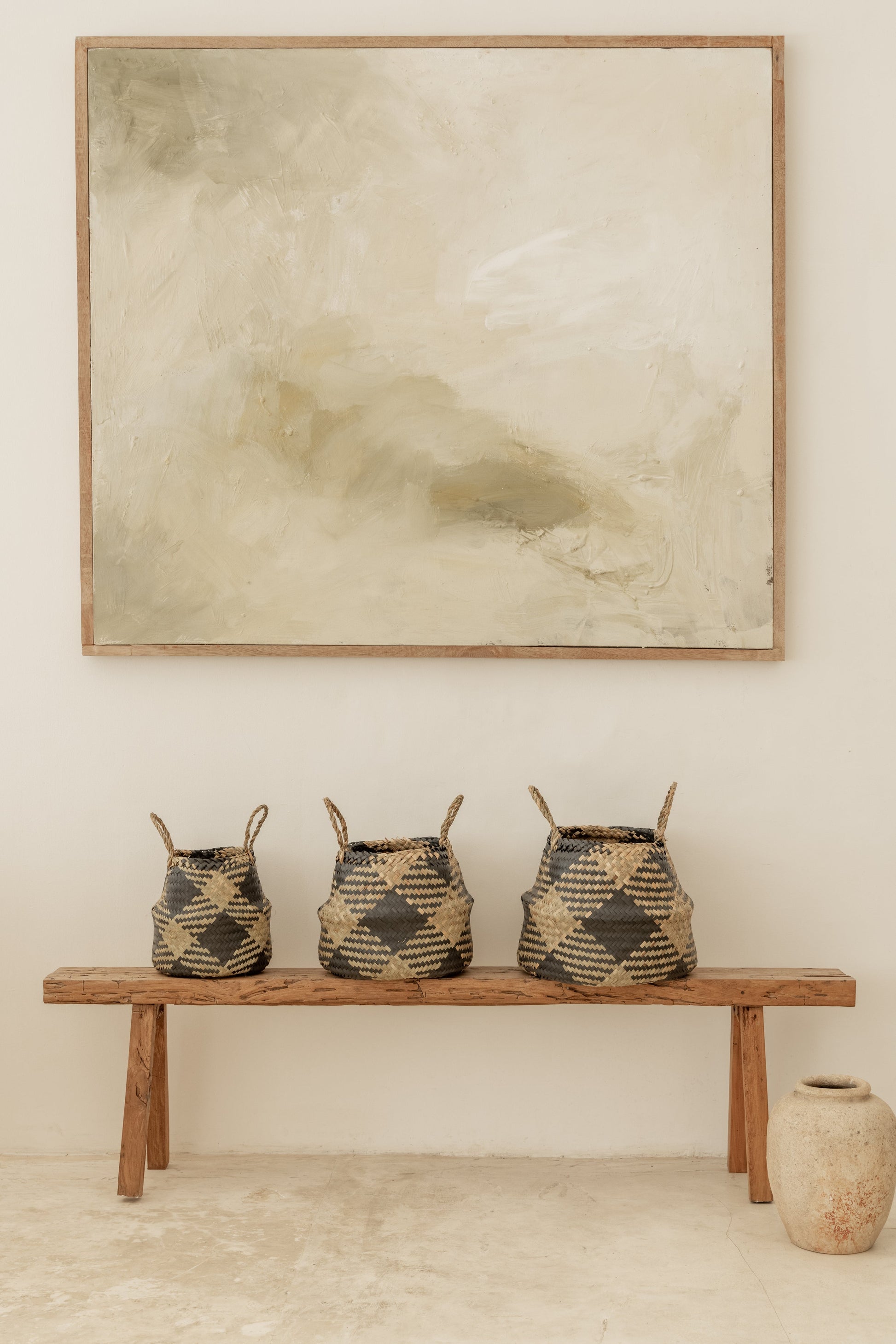 Plaid Woven Storage Basket handmade by Village Thrive using natural materials.