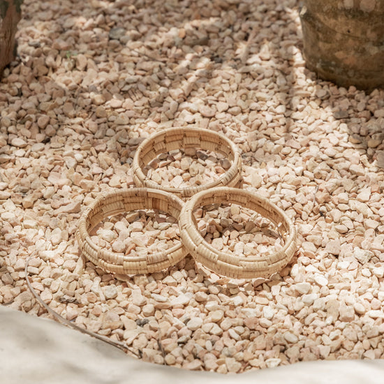 Statement Checker Weave Bangle handmade by Village Thrive using natural materials.