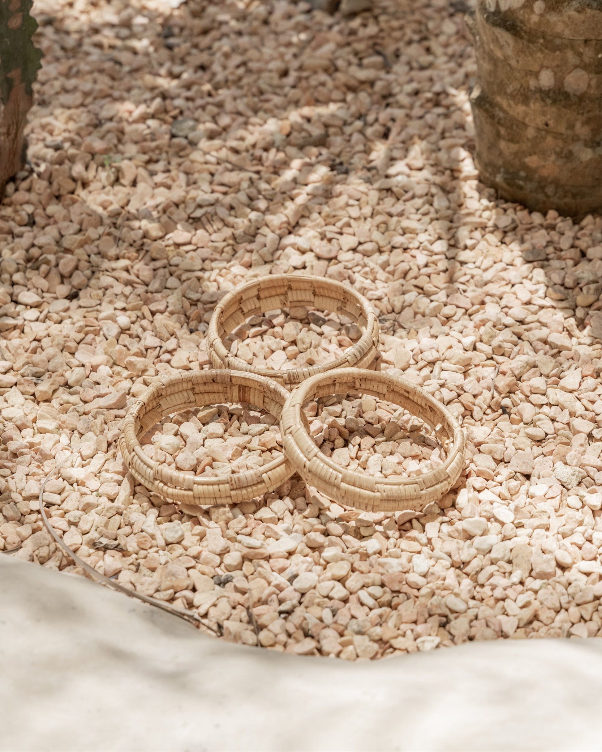 Statement Checker Weave Bangle handmade by Village Thrive using natural materials.
