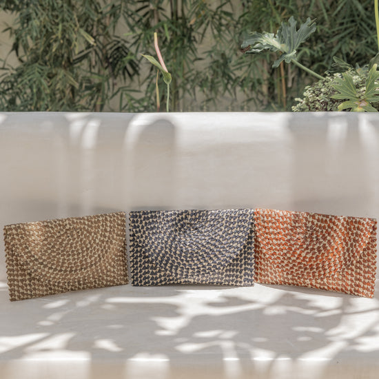 Ombre Rattan Clutch handmade by Village Thrive using natural materials.