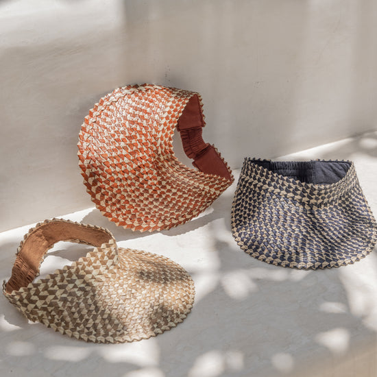 Ombre Rattan Sun Visors handmade by Village Thrive using natural materials.