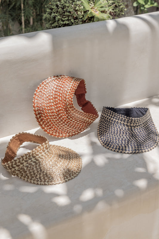 Ombre Rattan Sun Visors handmade by Village Thrive using natural materials.