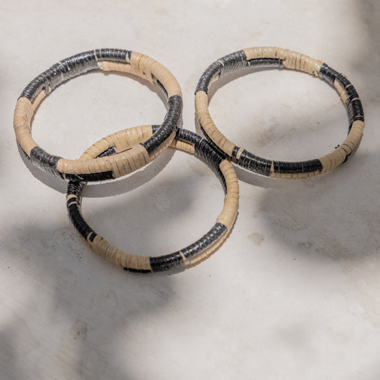 Black Motif Rattan Bangle handmade by Village Thrive using natural materials.