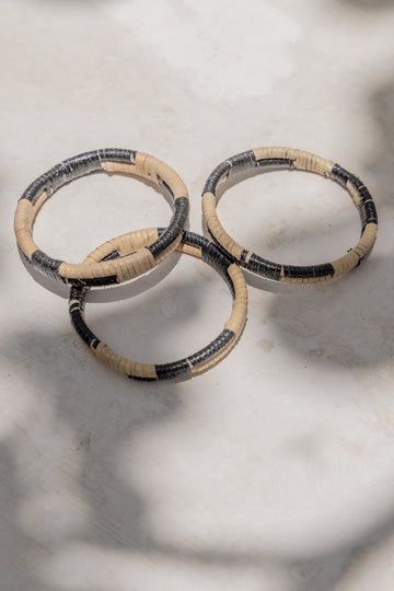 Black Motif Rattan Bangle handmade by Village Thrive using natural materials.