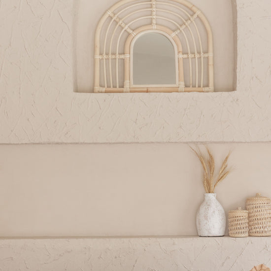 Rainbow Rattan Mirror handmade by Village Thrive using natural materials.
