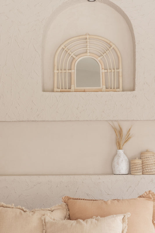 Rainbow Rattan Mirror handmade by Village Thrive using natural materials.