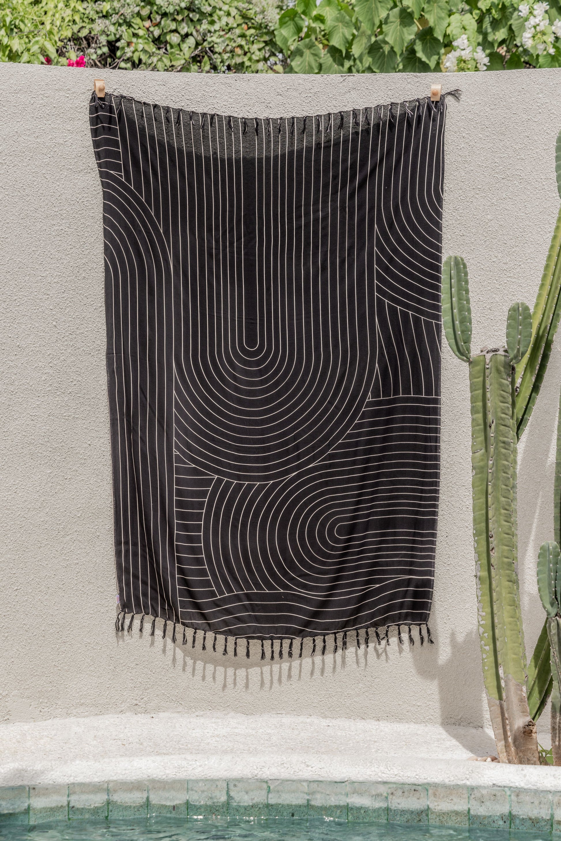 Drift Tapestry handmade by Village Thrive using natural materials.