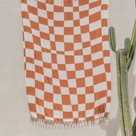 Checkered Tapestry handmade by Village Thrive using natural materials.