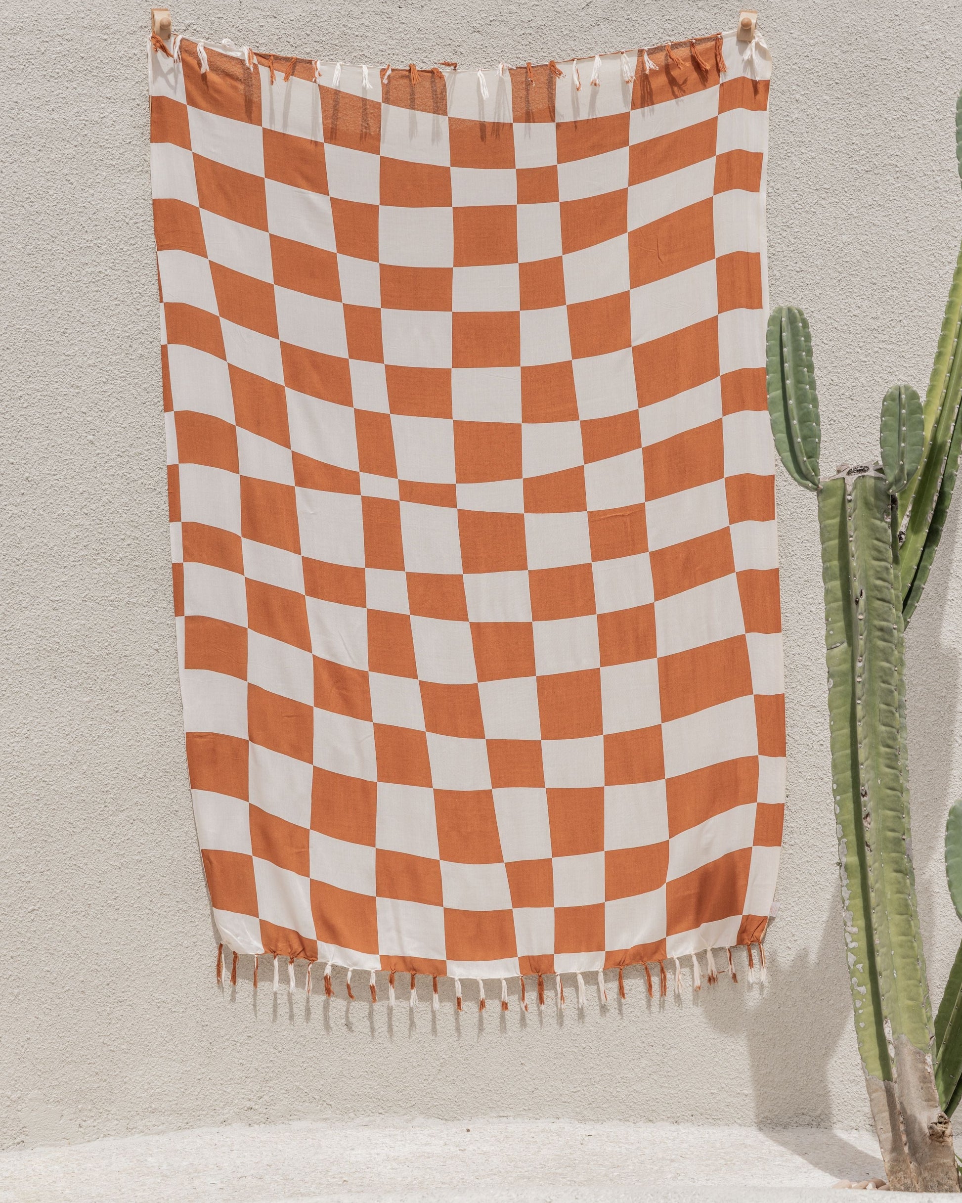 Checkered Tapestry handmade by Village Thrive using natural materials.