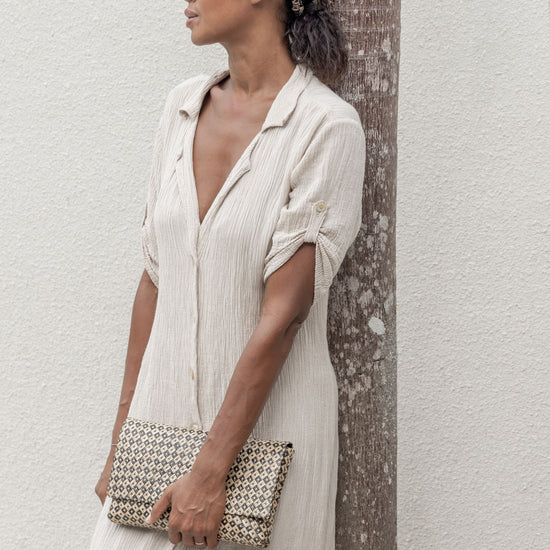 Woven Clutch handmade by Village Thrive using natural materials.