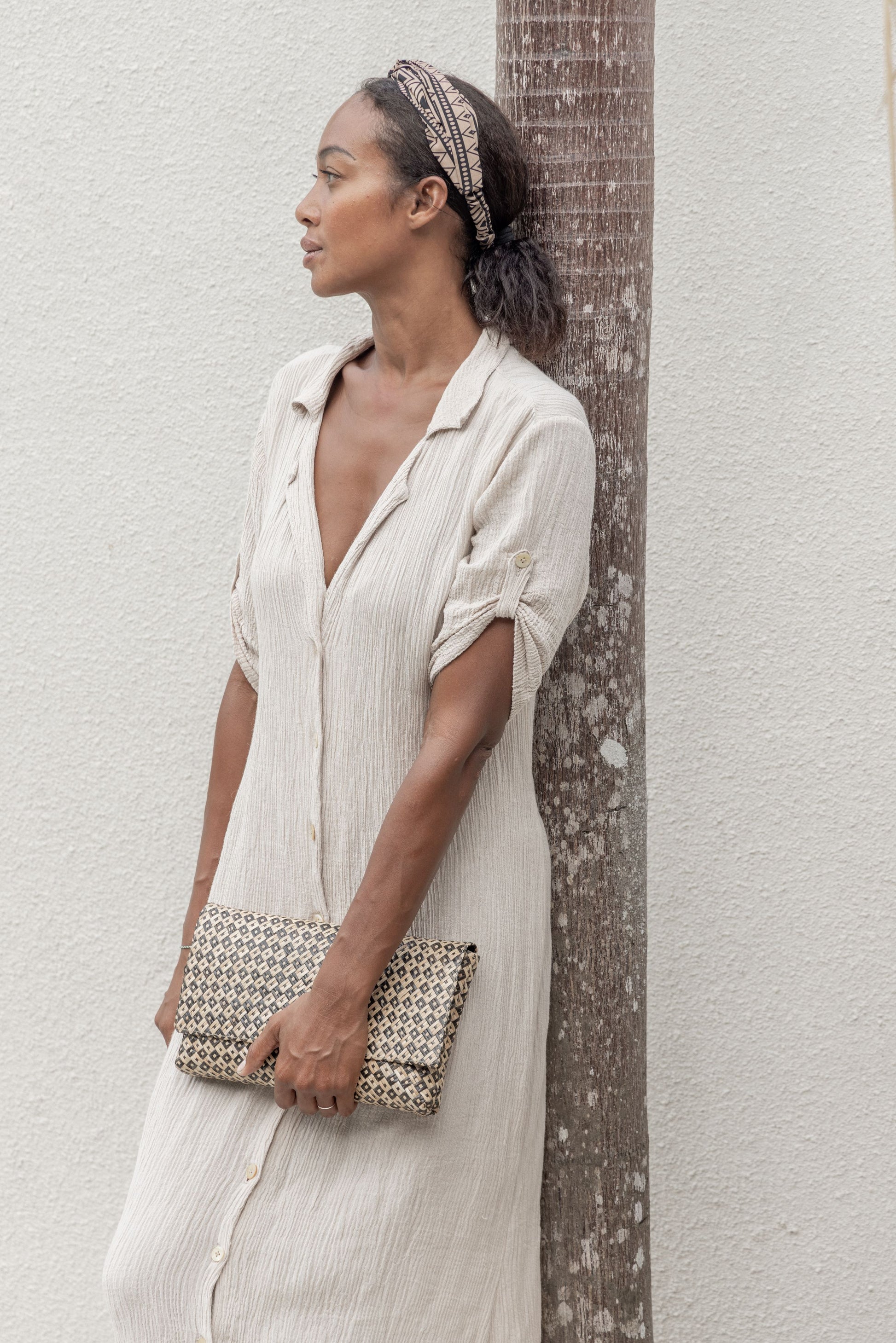 Woven Clutch handmade by Village Thrive using natural materials.