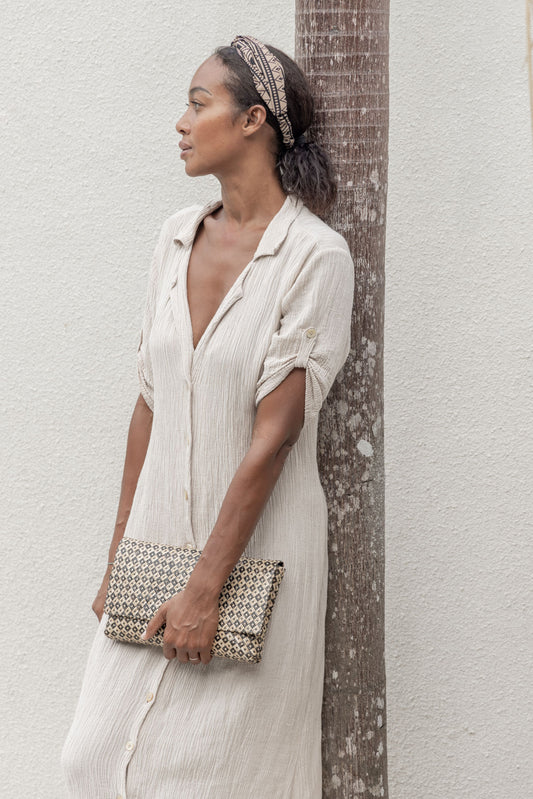 Woven Clutch handmade by Village Thrive using natural materials.