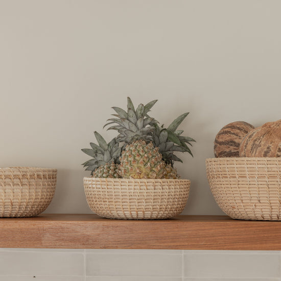 Rattan Nesting Bowl Set handmade by Village Thrive using natural materials.