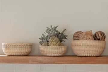 Rattan Nesting Bowl Set handmade by Village Thrive using natural materials.